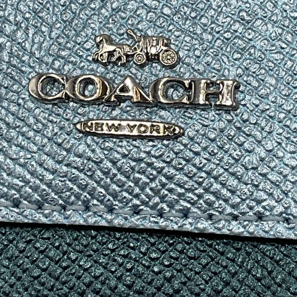 Coach zip top